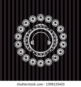 headphones icon inside silver shiny badge
