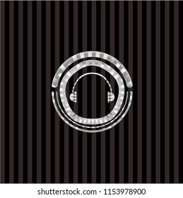 headphones icon inside silvery emblem