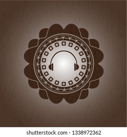 headphones icon inside wood emblem. Vintage.