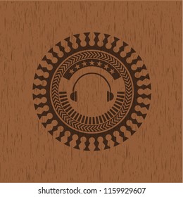headphones icon inside wooden emblem. Retro