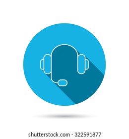 Headphones with microphone icon. Musical notes signs. Blue flat circle button with shadow. Vector