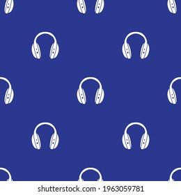 Headphones on blue background seamless pattern. Vector illustration.