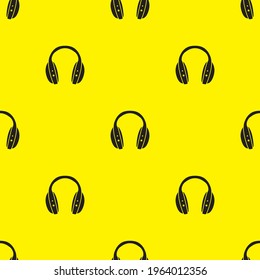 Headphones on yellow background seamless pattern. Vector illustration.