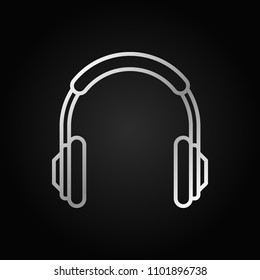 Headphones outline silver vector concept icon. Headphone isolated symbol on dark background