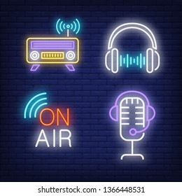 Headphones, radio and microphone neon signs set. Radio, entertainment design. Night bright neon sign, colorful billboard, light banner. Vector illustration in neon style.