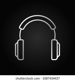 Headphones vector silver modern icon or design element in thin line style on dark background