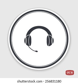 Headset with a microphone icon. Flat design style. Made in vector. Emblem or label with shadow.