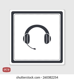Headset with a microphone icon. Flat design style. Made in vector. Emblem or label with shadow.