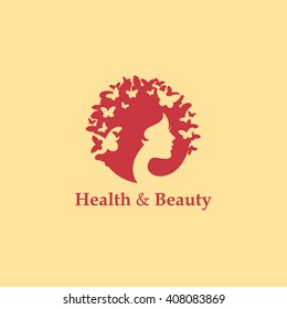 Health and beauty logo concept: woman's face and butterflies. Logo for beauty salon, massage, cosmetics, spa or medical clinic. Flat design.