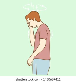 Health and pain. Stressed exhausted young man having strong tension headache.