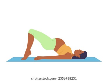 Healthy active pregnant woman in sportswear doing yoga standing in bridge pose on floor exercise mat