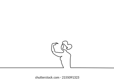 a healthy beautiful woman shows herself with her arms and stands confidently