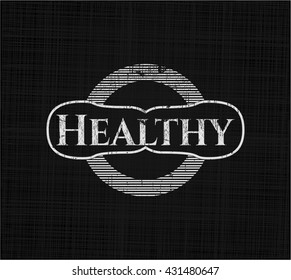 Healthy chalkboard emblem written on a blackboard