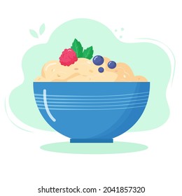 Healthy food for breakfast. Oatmeal porridge with raspberry and blueberry in bowl.