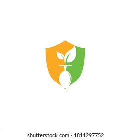Healthy food shield shape logo template concept. Organic food logo with spoon and leaf symbol.