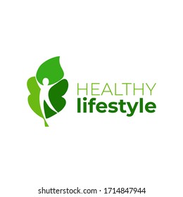 Healthy lifestyle logo template. Lifestyle vector design. Wellness logotype. Leaf with a woman silhouette in negative space.