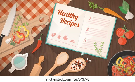 Healthy recipes cookbook, kitchen utensils and ingredients on the kitchen table, food preparation and learning concept