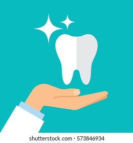 A healthy tooth on the hand of the dentist. Flat design. Vector illustration.