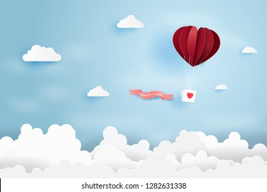 Heart air balloon made origami float over blue sky,Paper art style.