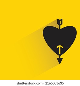 heart with arrow bow on yellow background