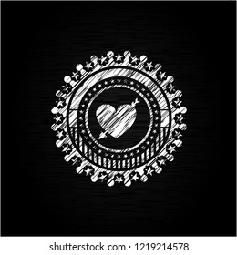 heart with arrow icon drawn on blackboard