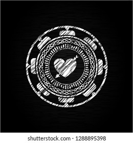 heart with arrow icon drawn on a chalkboard