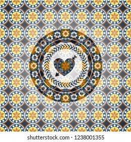 heart with arrow icon inside arabic badge. Arabesque decoration.