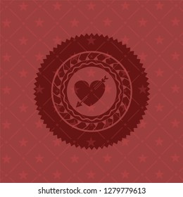heart with arrow icon inside badge with red background