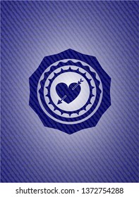 heart with arrow icon inside badge with denim background