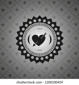 heart with arrow icon inside black badge
