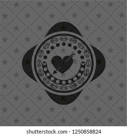 heart with arrow icon inside black emblem