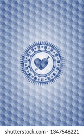 heart with arrow icon inside blue emblem with geometric pattern.
