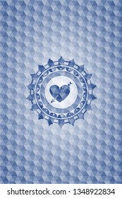 heart with arrow icon inside blue polygonal emblem.