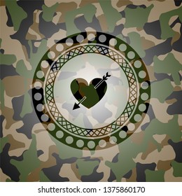 heart with arrow icon inside camo emblem