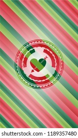 heart with arrow icon inside christmas style badge..