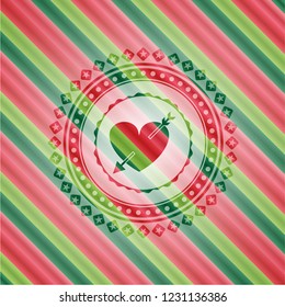 heart with arrow icon inside christmas badge.