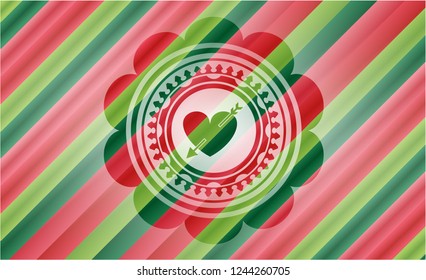 heart with arrow icon inside christmas colors emblem.