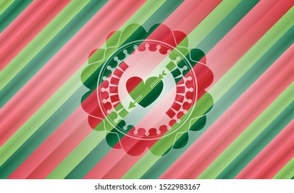 heart with arrow icon inside christmas colors emblem.