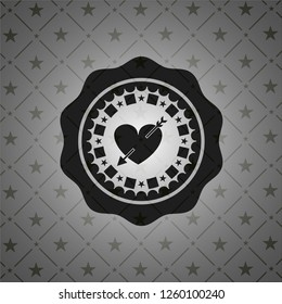 heart with arrow icon inside dark badge or emblem