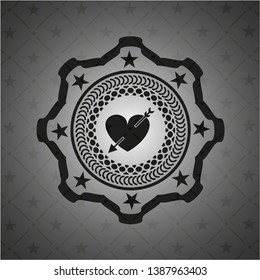 heart with arrow icon inside dark emblem