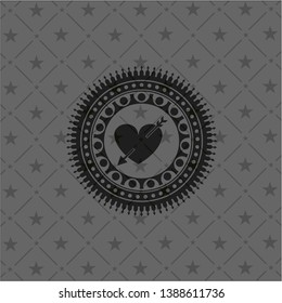 heart with arrow icon inside dark badge or emblem