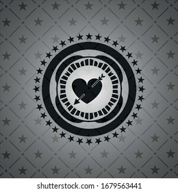 heart with arrow icon inside dark badge or emblem