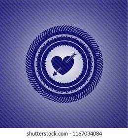 heart with arrow icon inside emblem with denim texture