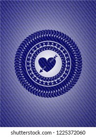 heart with arrow icon inside emblem with denim texture