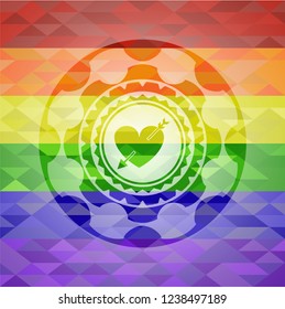 heart with arrow icon inside emblem on mosaic background with the colors of the LGBT flag
