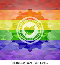 heart with arrow icon inside emblem on mosaic background with the colors of the LGBT flag