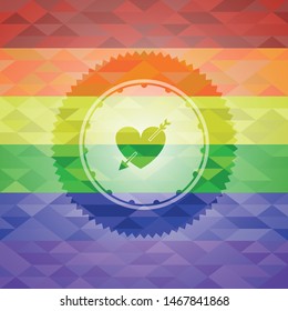 heart with arrow icon inside emblem on mosaic background with the colors of the LGBT flag