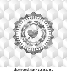 heart with arrow icon inside grey icon or emblem with geometric cube white background