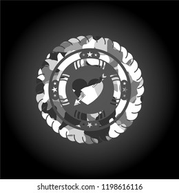 heart with arrow icon inside grey camo emblem