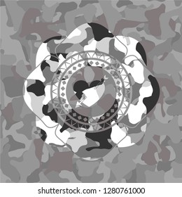 heart with arrow icon inside grey camo emblem
